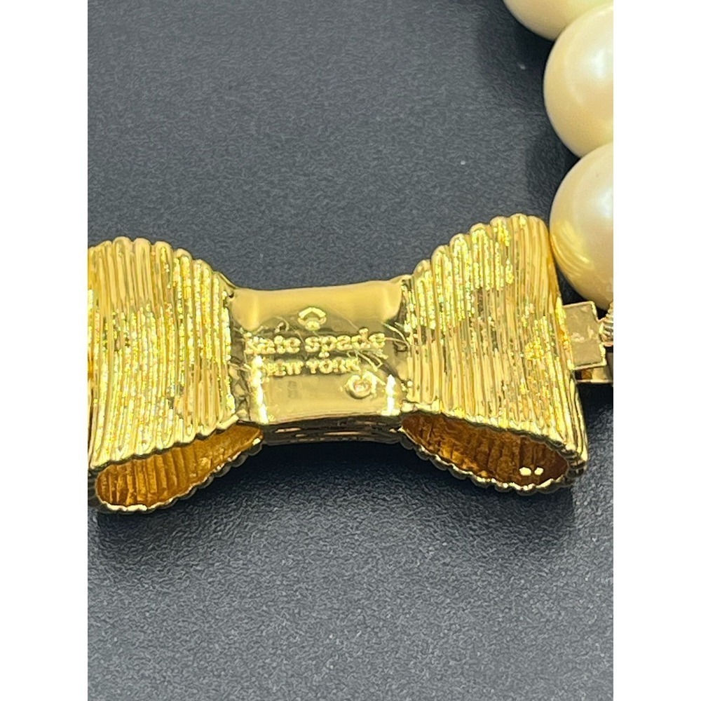 Kate Spade All Wrapped Up Pearl Gold Bow Bracelet - Picture 6 of 13